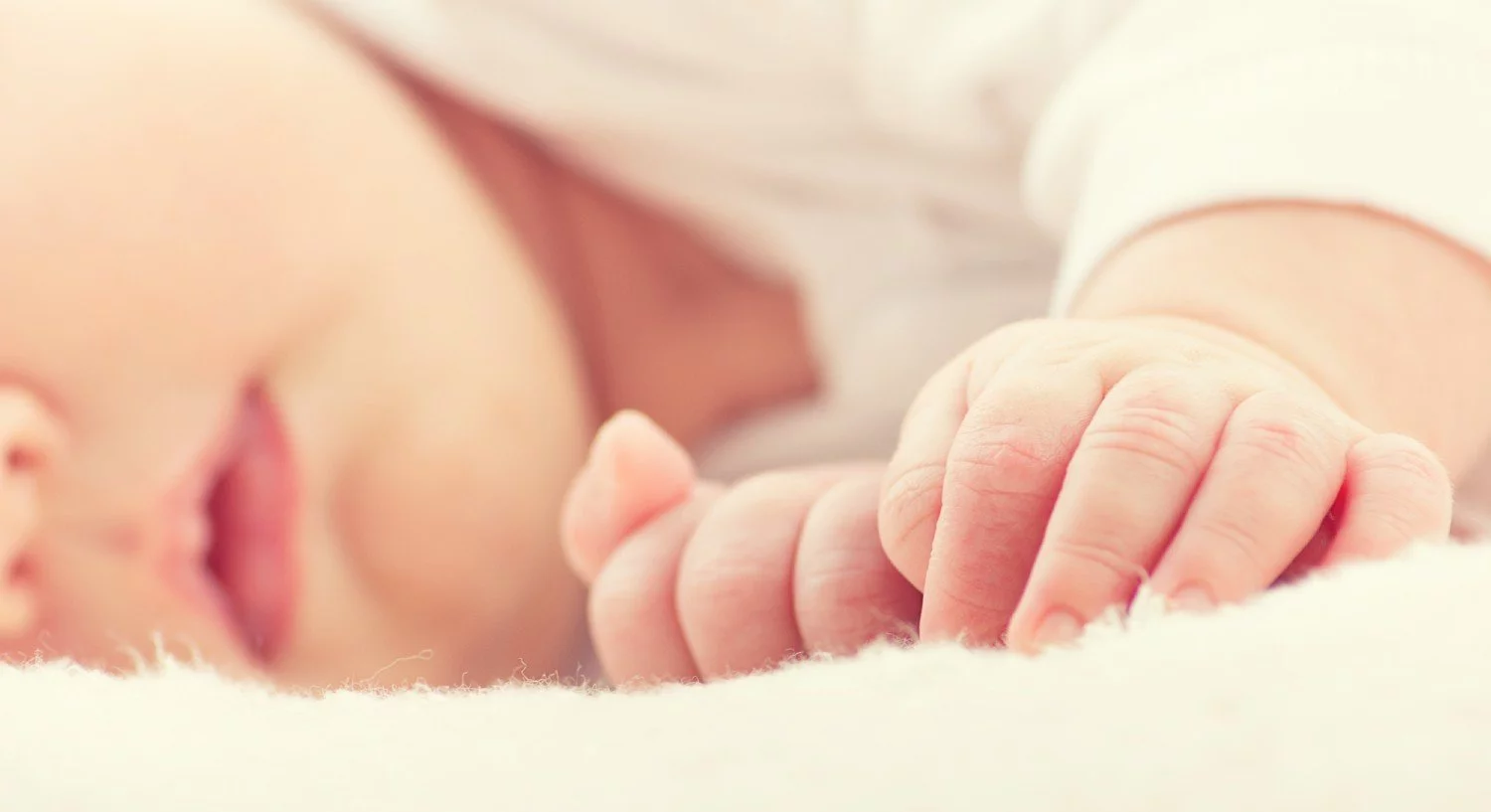 Baby sleeping peacefully in bed